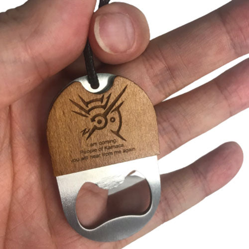 a hand holding a personalised wooden keyring and bottle opener