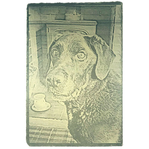 a pet dog laser engraved on slate as a memorial using a customer photo