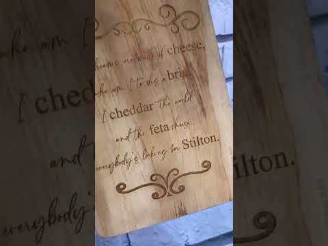 an engraved cheese board with fun cheese poem