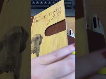 a customer opening one of our personalised bamboo notebooks on a desk at work